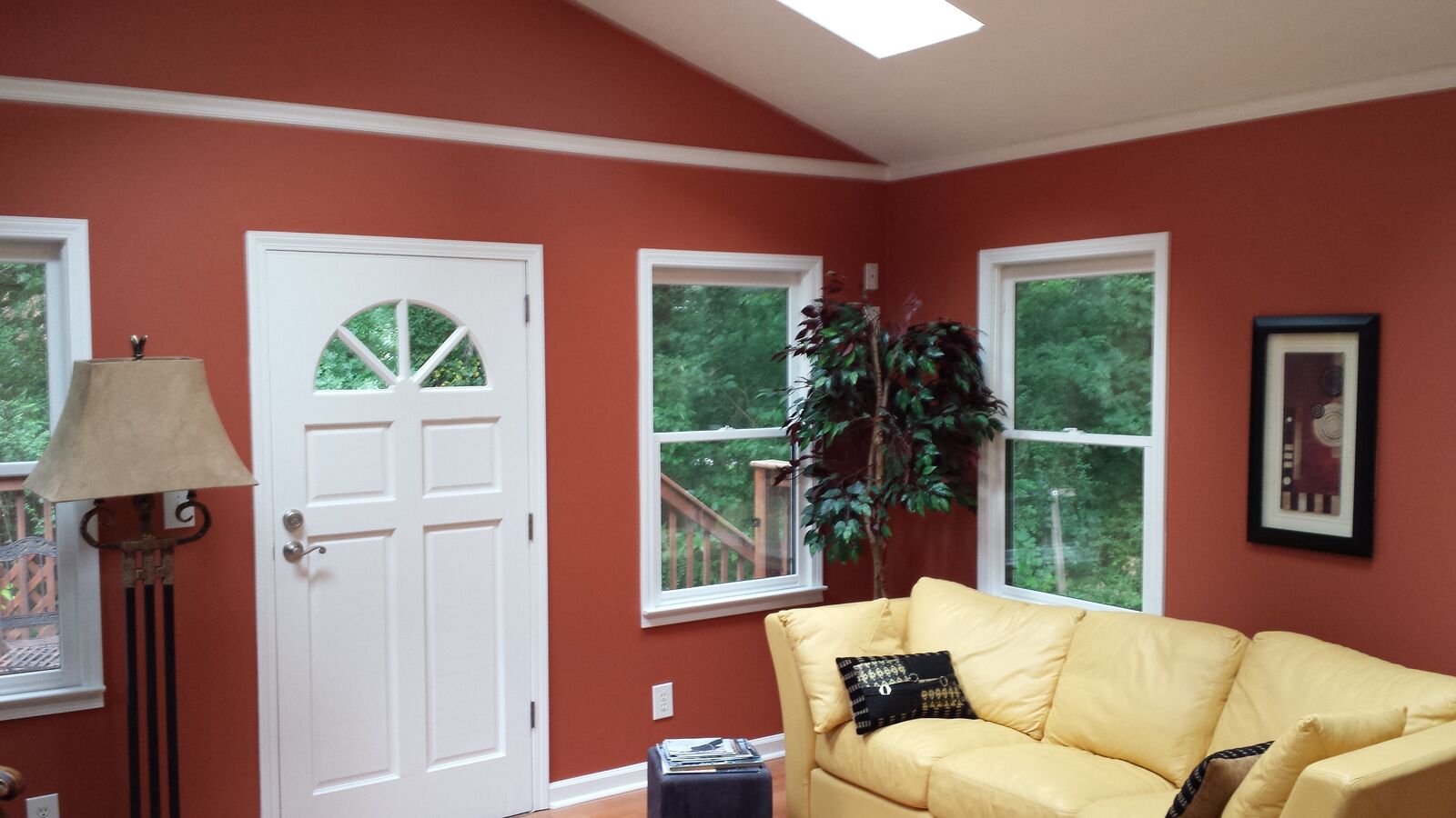 Interior with warm accent walls and high-gloss white trim