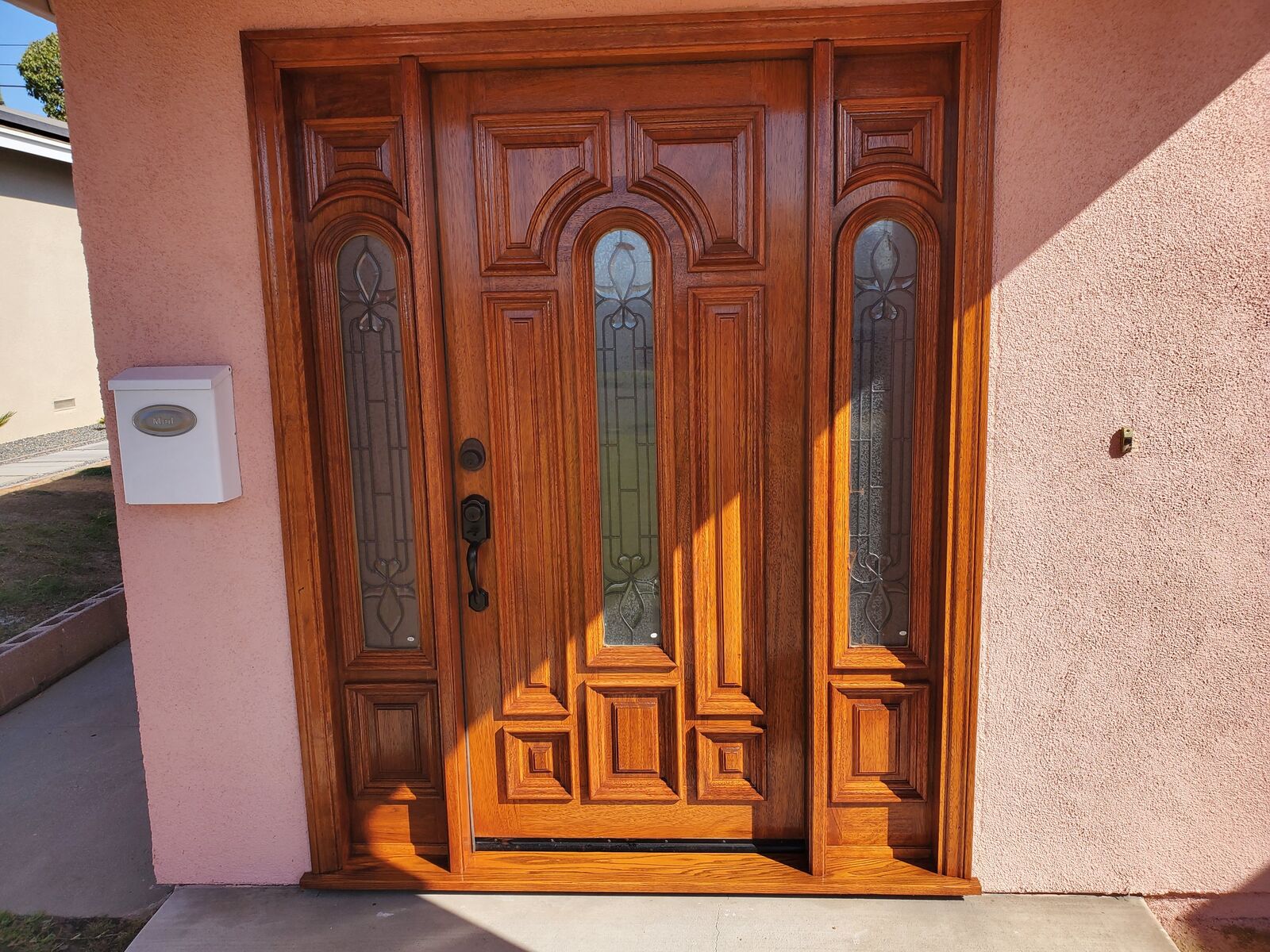 Entry door and sidelights finished in Gun Stock semi-transparent stain